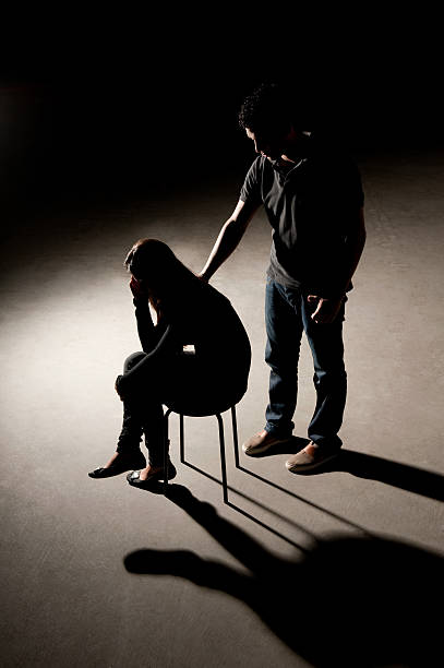 Man comforting a woman