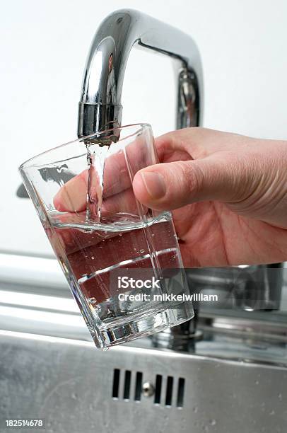 Pouring A Glass Of Water From A Faucet Stock Photo - Download Image Now - Drinking Glass, Water, Faucet