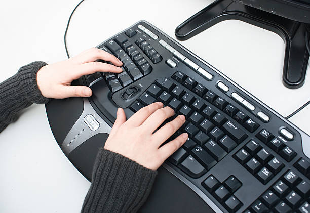 Ergonomic keyboard Use Ergonomic keyboard to protect the health of hand ergonomic keyboard photos stock pictures, royalty-free photos & images
