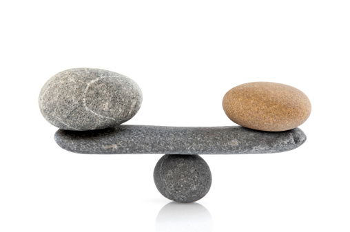 Balancing stones on white background