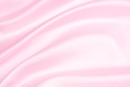 Pink satin background.  Shallow depth of field.  YOU MIGHT ALSO LIKE: