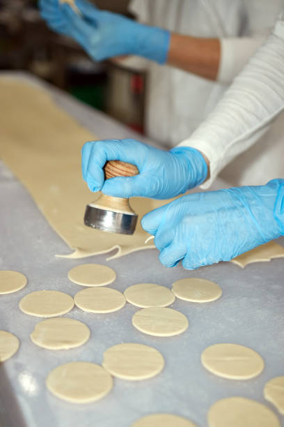 istock Cooking dumplings. Forming dough for making dumplings. Homemade food. 1825148178