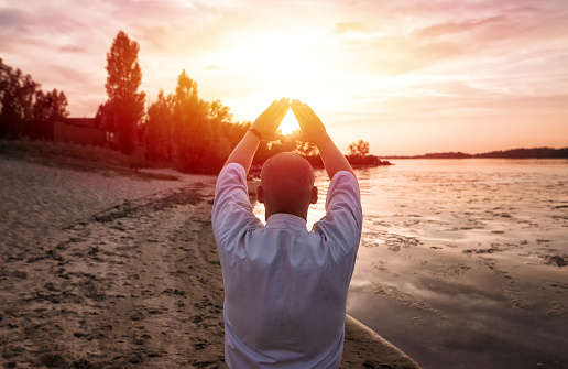 karate meditation of sensey on sunset