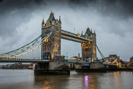 Illuminated Tower Bridge spanning over River Thames at dawn. London -  United Kingdom