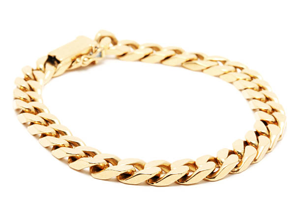 Gold Chain on White Background "Macro of a Gold Chain on White Background, shallow dof" bracelet photos stock pictures, royalty-free photos & images