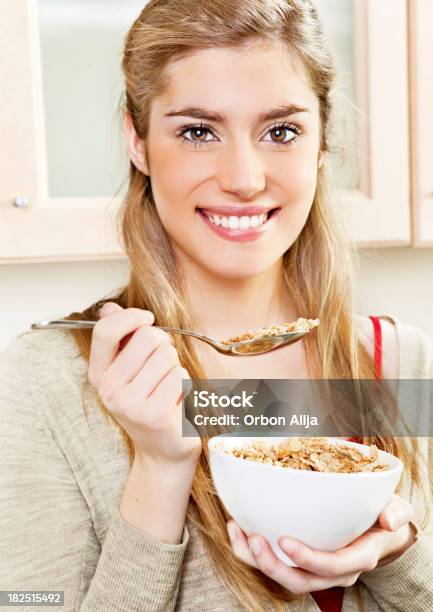 Teenager Eating Cereal Stock Photo - Download Image Now - 16-17 Years, Adolescence, Beautiful People