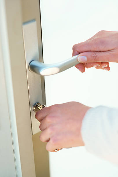 istock Female hands opening the door using a key 182515789