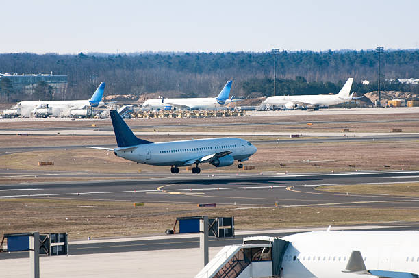 istock Airplane landing at airport, hovering over runway 182515896