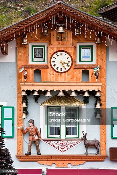 Alpine Wooden Facade With Clock And Bells Dolomites In Summer Stock Photo - Download Image Now