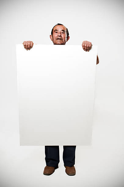 istock senior adult man hold a banner 182517044