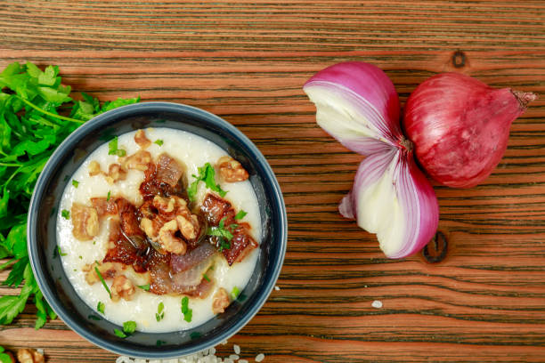 istock Egyptian Kishk keshj almaz with wlanuts, Coriander, and onion served in pot isolated on table top view of arabic food 1825178915