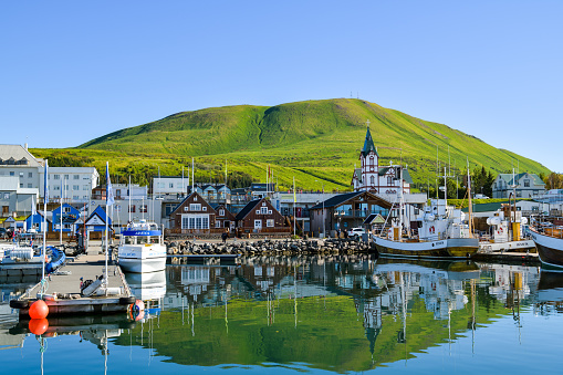 Husavik, Iceland - September 9, 2022: View on small city of Husavik in Iceland from harbor during September 2022