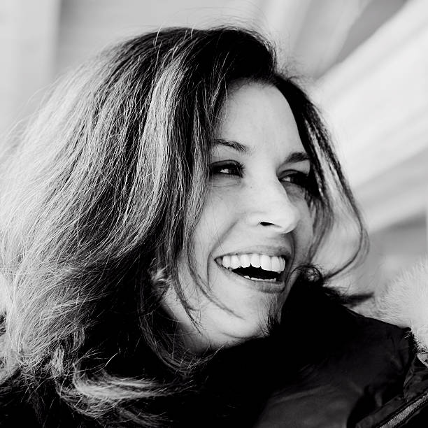 istock beautiful relaxed mature woman laughing 182518025