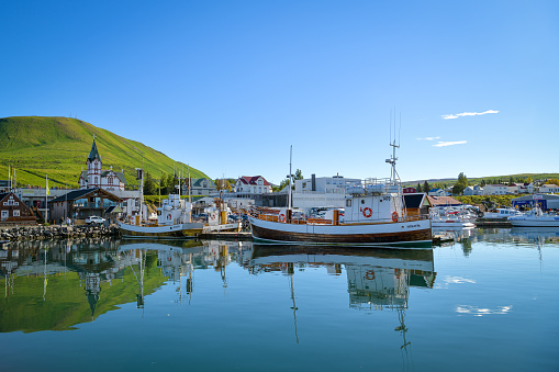 Husavik, Iceland - September 9, 2022: Small harbor in Husavik in Iceland during beautiful sunny day in September 2022