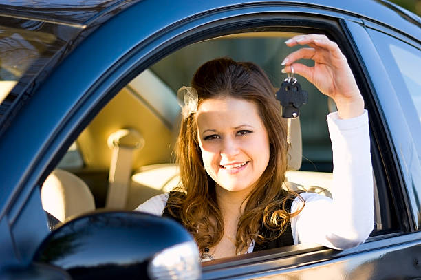 istock Young Woman with Car Key 182519144