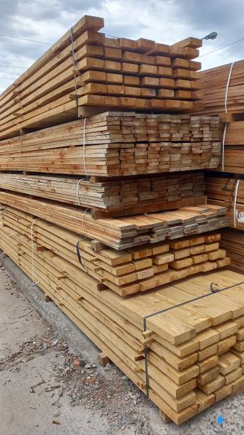 istock Many stacked wooden boards. lumber concept. 1825192657
