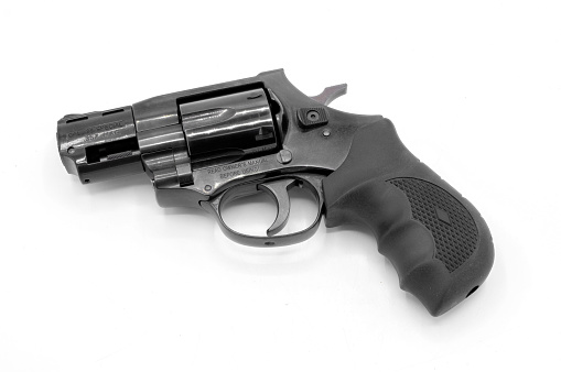 Ocala, FL November 29, 2023. 357 magnum revolver gun .38 caliber special with cylinder close. Black metal with rubber grip 6 cartridge ammo ammunition. Self defense weapon isolated on white background