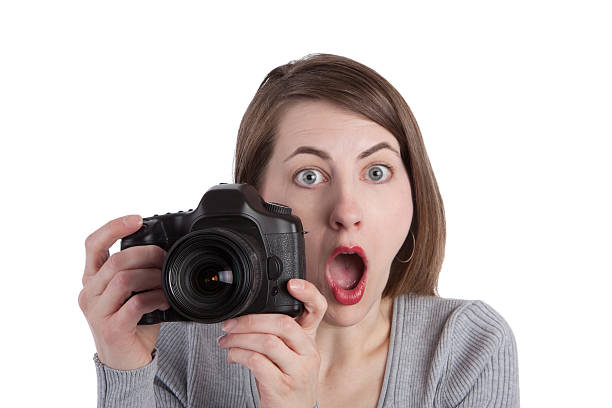 istock Shocked Photographer Holding Digital Camera 182519542