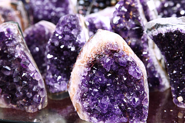 Amethyst Semi Precious Rock Rough Cut Pieces of Brazilian Amethyst broken from geode at a shop in Spice Bazaar Istanbul. geode photos stock pictures, royalty-free photos & images