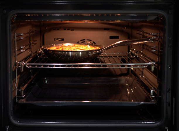 istock pie being cooked in the oven in the kitchen 1825207669