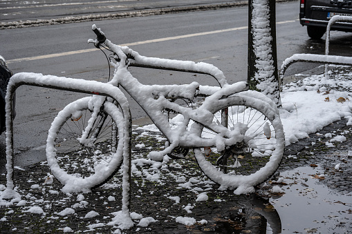 Leipzig, Germany. 1 of December 2023.\nParked bicycle covered in snow.