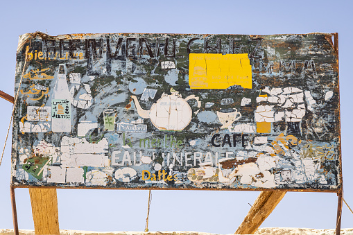 Chott el Djerid, Tozeur, Tunisia. March 18, 2023. Delapidated billboard at the Chott el Djerid dry salt lake.