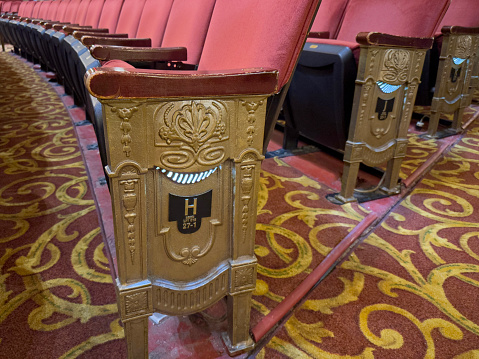 Close up details from a classical style old movie theater seats