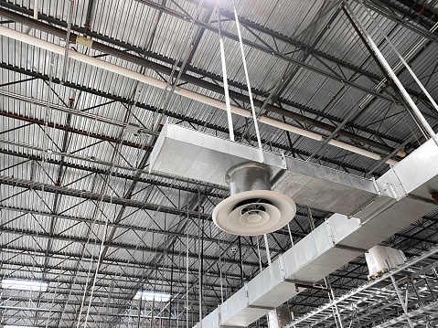 Looking up to an industrial ceiling with air duct