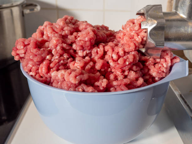 istock An electric meat grinder grinds meat into minced meat. 1825281456