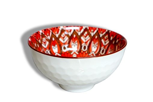 Ceramic bowl with motif isolated on white background