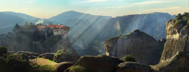 Photo of Big monastery of  Meteora ( Megala meteora) over sunrise. Greece. unesco hheritage site and popular greek destination