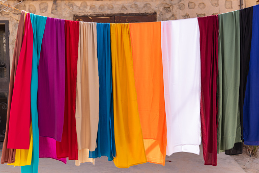 Shabikah, Tozeur, Tunisia. Colorful cloth for sale at a market in Shabikah.