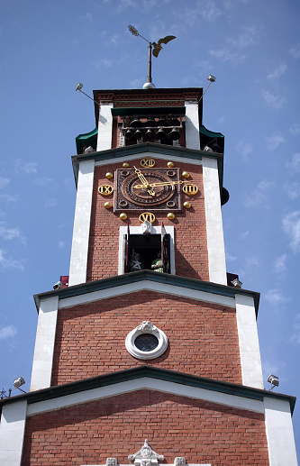 Orenburg, Russia -June 23, 2016. View on The clock tower in center of Orenburg city on summer time, Russia