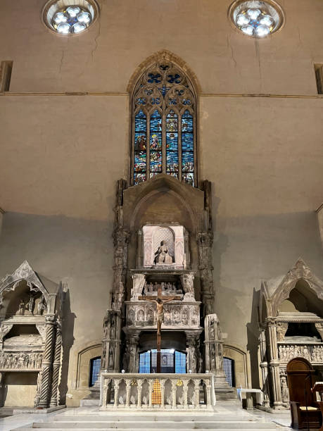 Naples, Italy, Campania, September 28, 2023: Inside the Santa Chiara complex, Monastero di Santa Chiara in Naples. Colorful stained glass above the altar Naples, Italy, Campania, September 28, 2023: Inside the Santa Chiara complex, Monastero di Santa Chiara in Naples. Colorful stained glass above the altar. saint naples italy italy santa chiara stock pictures, royalty-free photos & images