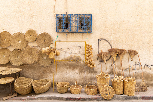 Bir Al Huffay, Sidi Bouzid, Tunisia. Woven baskets and brooms for sale at the outdoor souk in Bir al Haffay.