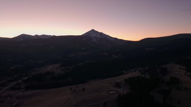 Distant drone shot of Lone Mountain in Big Sky, Montana