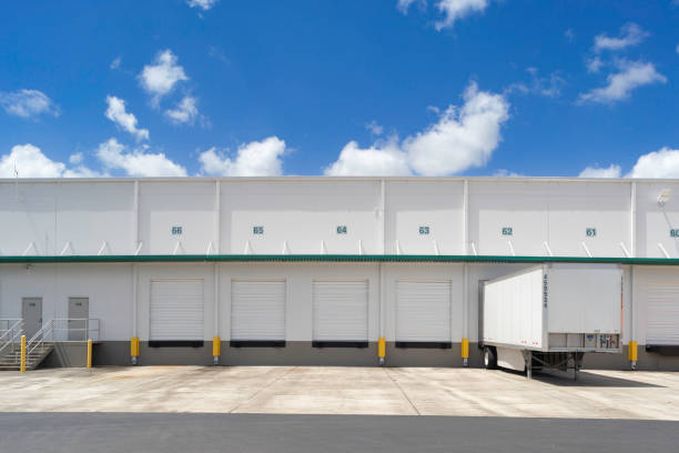 Trucks in loading dock of a warehouse.