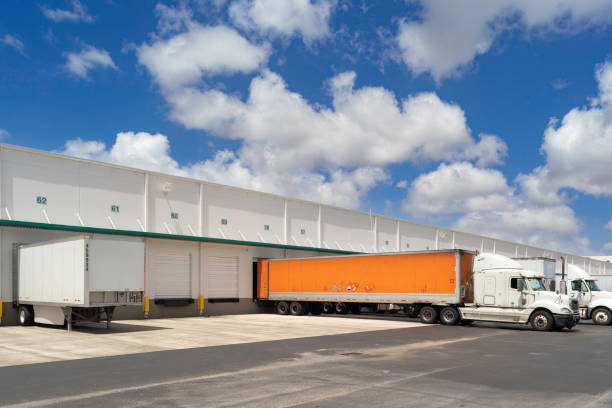istock Trucks in loading dock of a warehouse. 1825339094