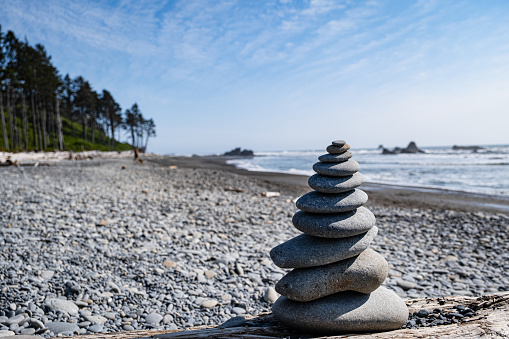 A rock cairn on Ruby Beach in Olympic National Park. The Pacific Ocean can be seen in the background.