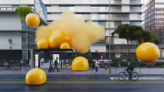A cluster of big yellow spheres in the middle of the city street. All objects in the scene are 3D