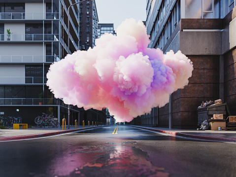 A soft pink cloud in the middle of the city street