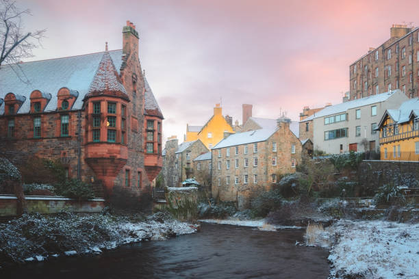 winter in dean village, edinburgh - winter stream river snowing stock-fotos und bilder