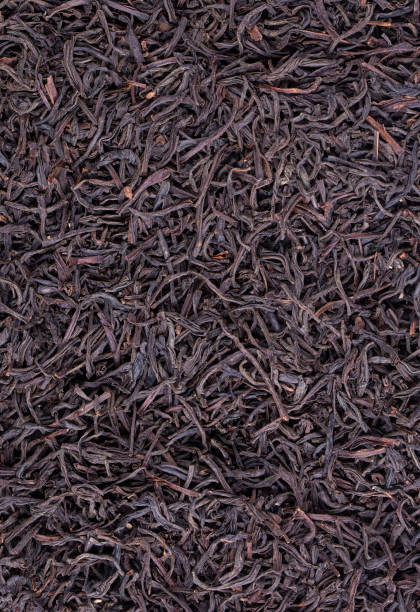 istock Heap of dried black tea leaves 1825405816