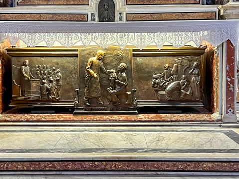 Naples, Italy - September 27, 2023: Tomb of Saint. Giuseppe Moscati in the Church of Jesus in Naples, Italy with bas-relief on the slab.