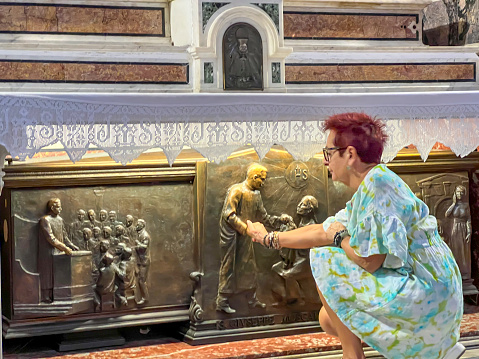 Naples, Italy - September 27, 2023: Tomb of Saint. Giuseppe Moscati in the Church of Jesus in Naples, Italy with bas-relief on the slab.