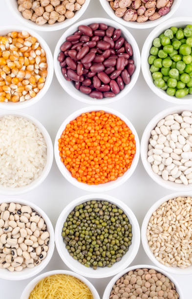 istock Mixed dried legumes and cereals isolated on white background, top view 1825408097