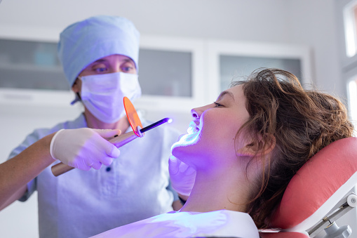 Dentist woman and teenager patient during dental consultation - Buenos Aires - Argentina