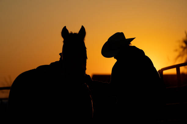 Old west cowboy hat on wooden table.