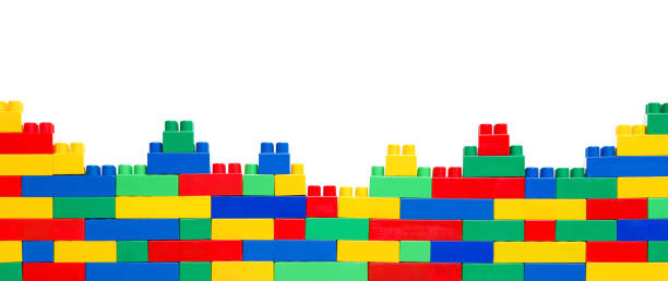 istock Kid's Wonderland: Constructing a World of Fun and Development. Banner. Wall from Colorful plastic brick blocks. Education, children's creativity 1825507251
