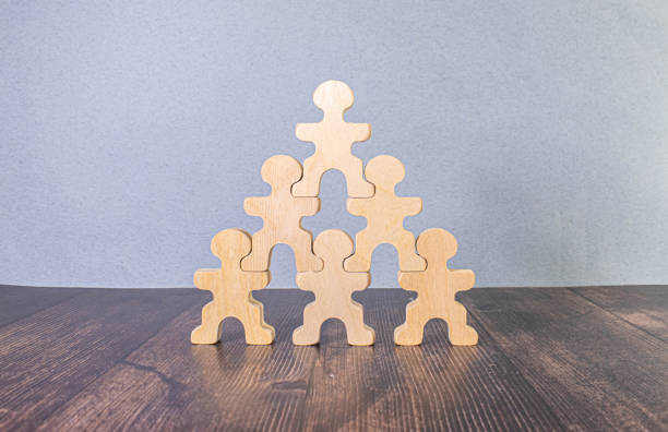 istock wooden unpainted nesting dolls stand on each other on white background. matryoshka dolls traditional symbol 1825524340